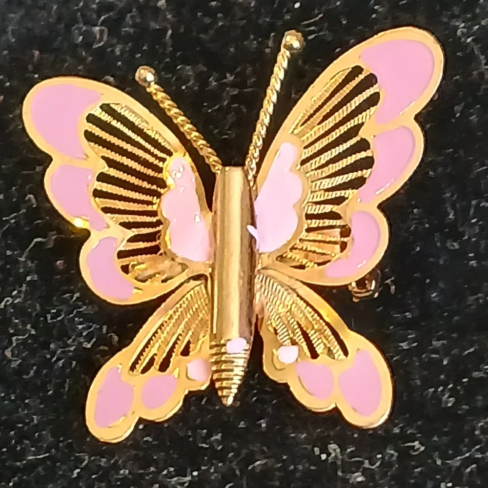 Vintage goldtone filigree butterfly brooch with pink accents